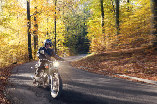 Biker Autumn Forest Road