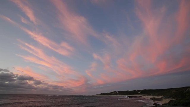 WS Pink wispy clouds hanging in sky at sunset