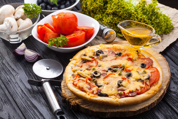 Obraz na płótnie Canvas Delicious Homemade pizza served on wooden table