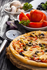 Delicious Homemade pizza served on wooden table