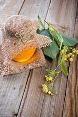 Linden honey on jar  on the  wooden table