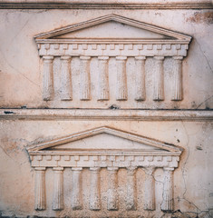 Greek or Roman portico embossed in stone, pattern or background template, close up
