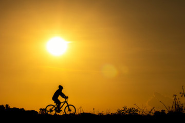 Fototapeta na wymiar Silhouette of cyclist in motion