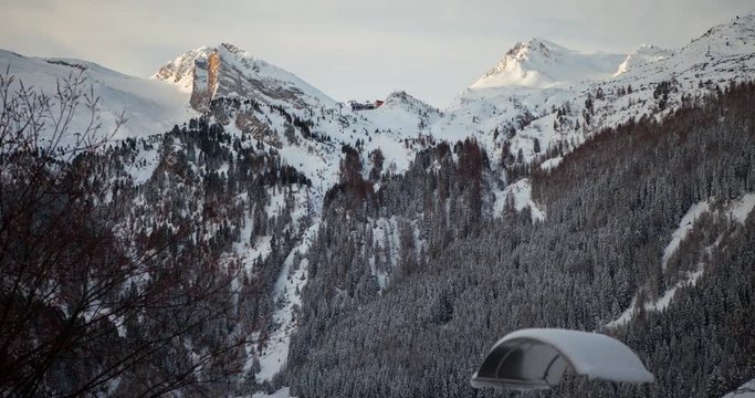 Zillertal, Tirol, Austria - snowy mountains in the alps at a cloudy day with sun and shadow - Timelapse without motion