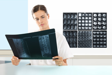 Radiologist woman checking xray, healthcare, medical and radiology concept