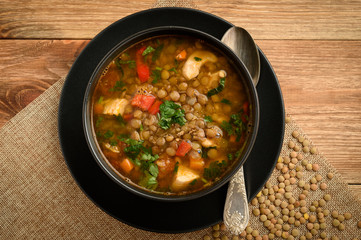 Hot soup with green lentil, chicken, vegetables and spices.