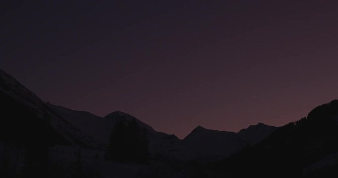 Zillertal, Tirol, Austria - colorful sunset over snowy mountains in the alps - Timelapse without motion