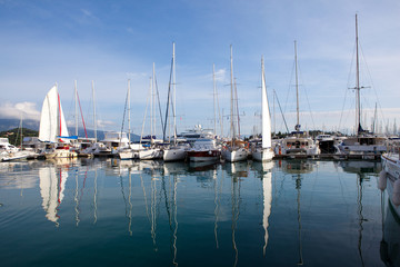 Fototapeta premium yachts at marina in Greece, reflected in the water