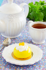 Cake with orange mousse and almond krokantom in the mirror glaze. Selective focus