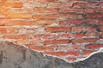 Vintage red brick wall for background with sunlight flare effect
