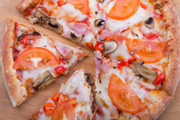 Italian pizza on a wooden background