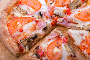 Italian pizza on a wooden background