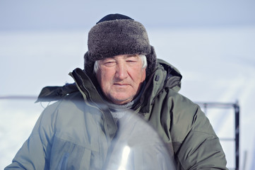 Fototapeta na wymiar Portrait of an elderly man. Winter.
