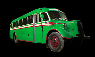 Old retro green bus. Isolated on black background.