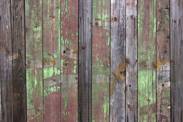 Fototapeta premium Texture wooden fence with horizontal yellow boards and faded pai