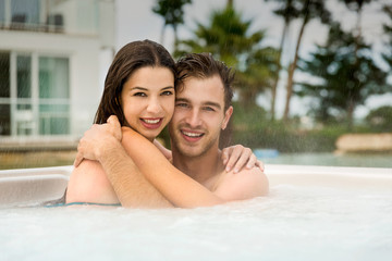 Young couple in a jacuzzi