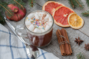 Christmas cocoa with whipped cream, chocolate, walnuts, cinnamon