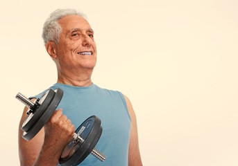Fototapeta premium Senior man with dumbbell.