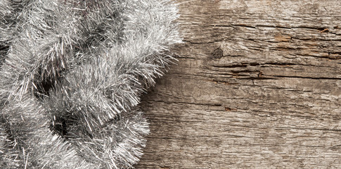 Christmas tinsel decorations on the wood