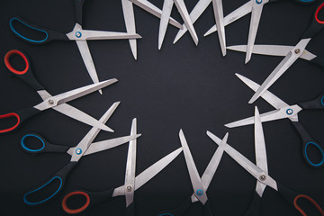 Red and blue scissors are on table