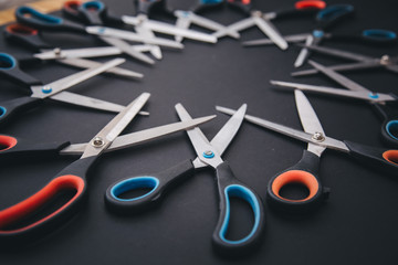 Red and blue scissors are on table