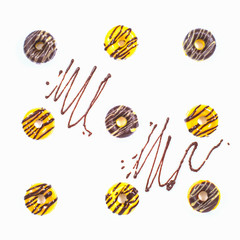 Homemade Glazed Donuts with decor on the white background. Top v