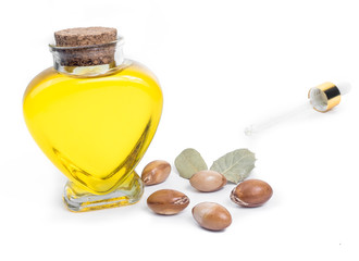 Bottle with oil. Cosmetic means. Food product. Jar with argan oil on the isolated background.