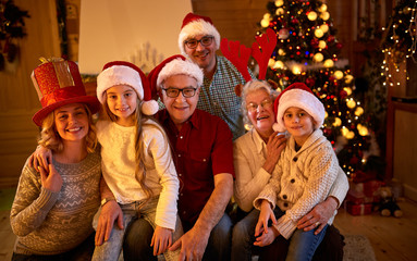 Happy family with gifts at xmas.