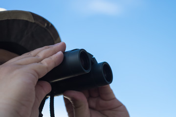 Close-up Of Human Hand Holding Binoculars