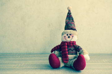 Snowman with vintage filter, On wooden table.