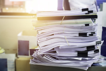 Pile of unfinished documents on office desk, Stack of business p