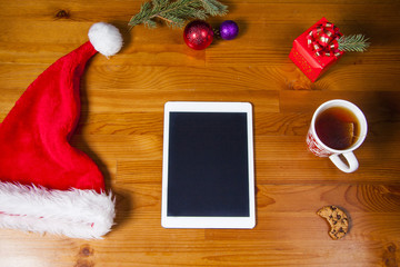 Desk view from above with digital tablet and presents, online shopping concept.
