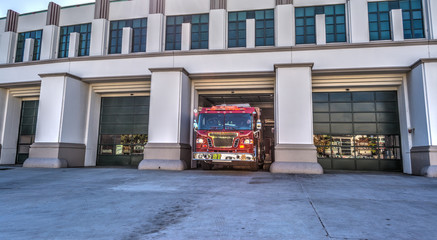 fire truck exits the parking garage