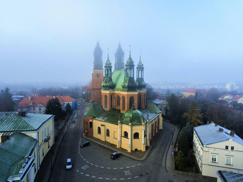 The Archcathedral Basilica of St. Peter and St. Paull in polish city Poznan Ostrow Tumski square.Aerial view, foggy day