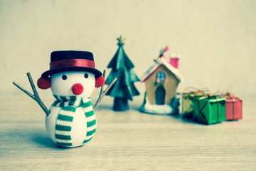 Snowman with vintage filter, On wooden table.