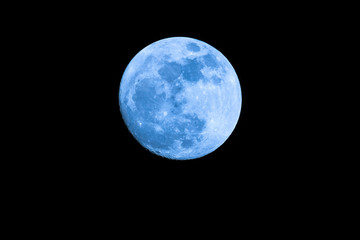 Big Blue Moon on dark night with copy space : shot at 1,260 mm. focal length. No crop image Detailed.
