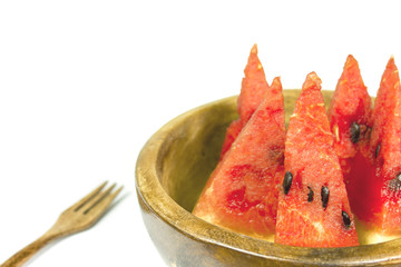 sliced of watermelon in a bowl on white background, isolated