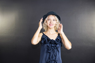 cute young blond woman in a hat