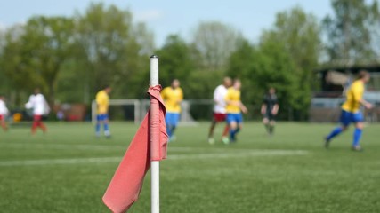 Soccer match and corner flag.
