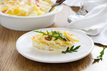 Baked potato Dauphinois on a plate.