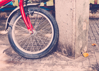 Retro filter image/ Vintage Red bicycle on the floor /With place your text