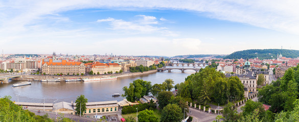 Naklejka premium Panorama of the old part of Prague from the Letna park. Beautiful view on the bridges over the river Vltava at sunset. Old Town architecture, Czech Republic.