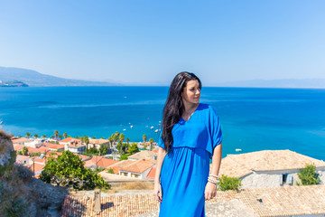 Fototapeta na wymiar beautiful greek young brunet woman in blue dress