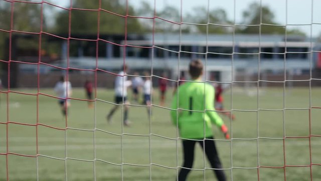 Football match from behind goal