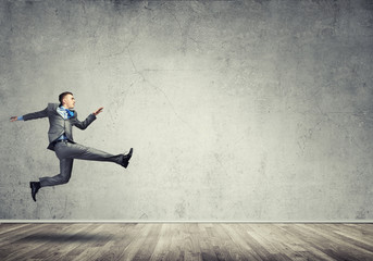 Businessman jumping high