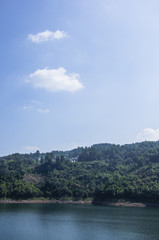 Fototapeta na wymiar The lake and mountains scenery with blue sky