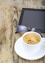 Workplace businessman: laptop, coffee and sunglasses