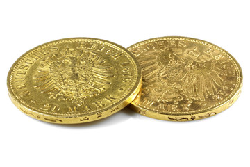 Hamburg gold coins (German Empire Goldmark) with older and younger type of Eagle isolated on white background