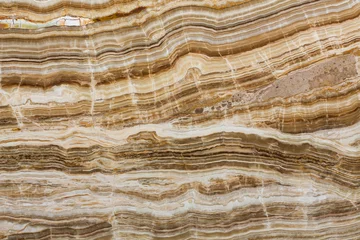 Foto auf Leinwand Onyx-Textur aus Naturstein, brauner Hintergrund. © Dmytro Synelnychenko