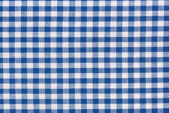 Blue checkered rural tablecloth background.